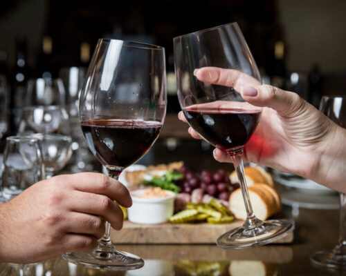 Two people toasting wine at Shelton Vineyards